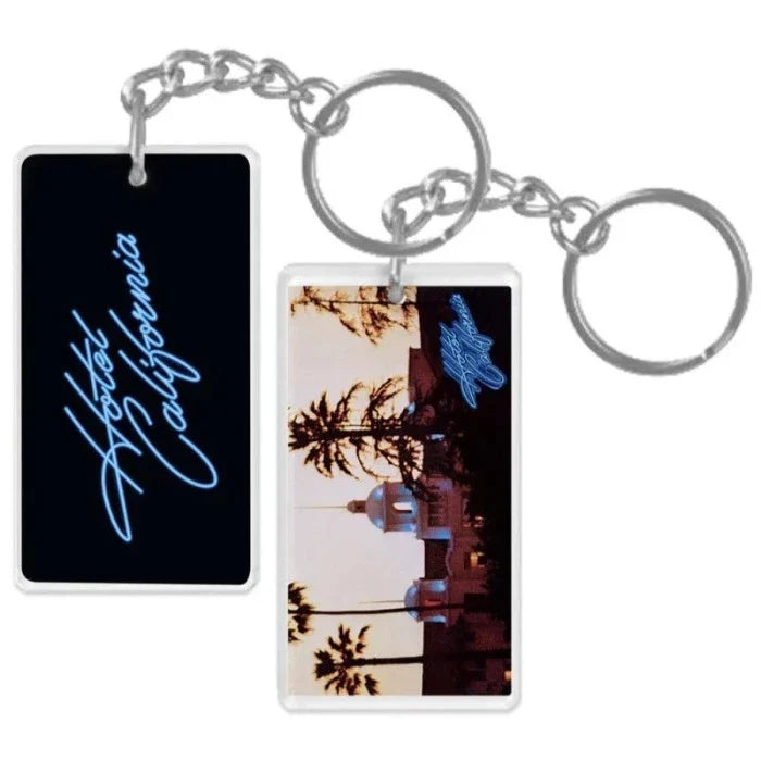 keychain-front cursive hotel california-back sunset hotel california building with palm trees